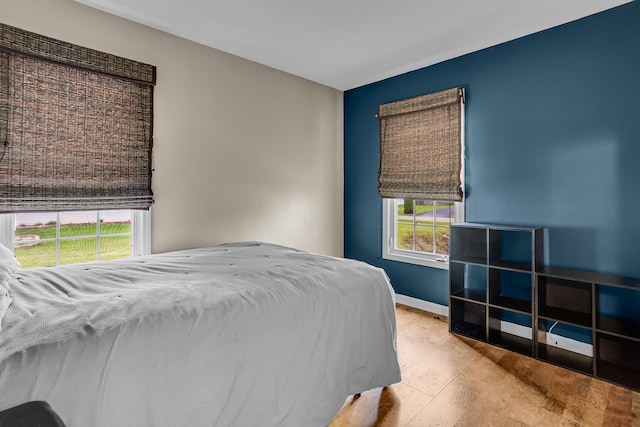 bedroom featuring baseboards