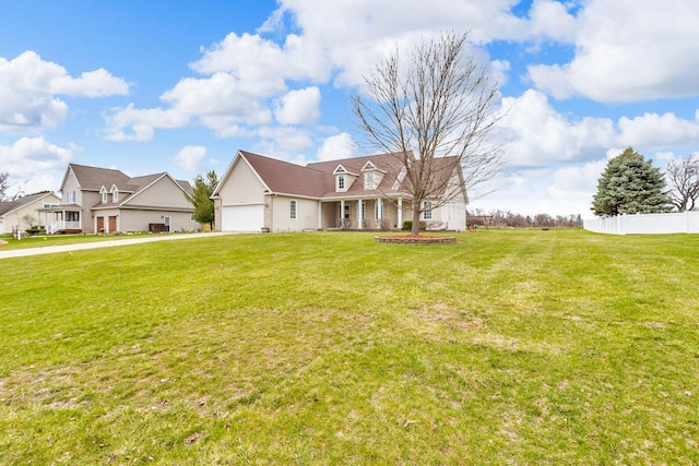 view of front facade featuring a front lawn, driveway, a porch, fence, and a garage