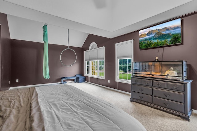 carpeted bedroom with lofted ceiling and baseboards