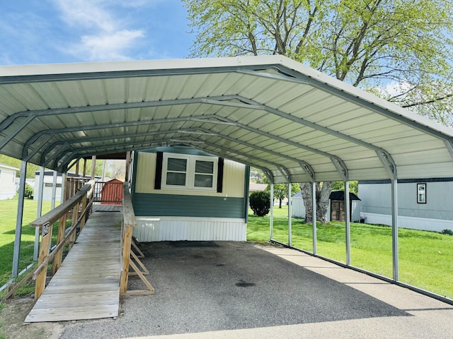 view of car parking with a carport and a shed