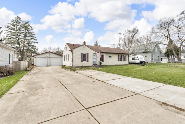 808 Longfellow Ave, Jackson, MI 49202 - view of front of property featuring a front lawn, a chimney, fence, a garage, and an outdoor structure