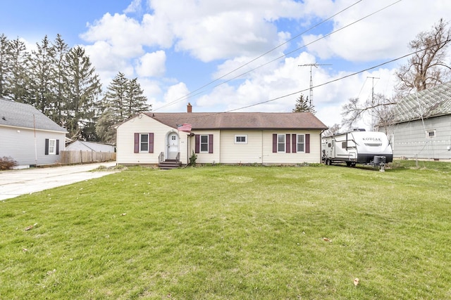 808 Longfellow Ave, Jackson, MI 49202 - view of front of home with a chimney, a front lawn, fence, and entry steps