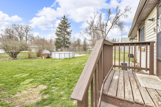808 Longfellow Ave, Jackson, MI 49202 - wooden terrace with an outdoor pool and a yard