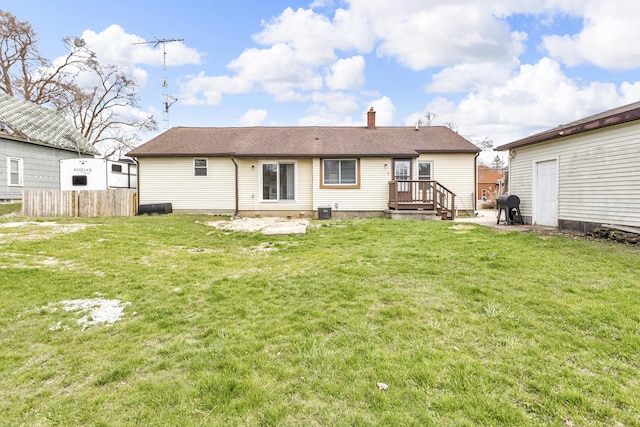 808 Longfellow Ave, Jackson, MI 49202 - rear view of house with a yard, roof with shingles, a chimney, and fence