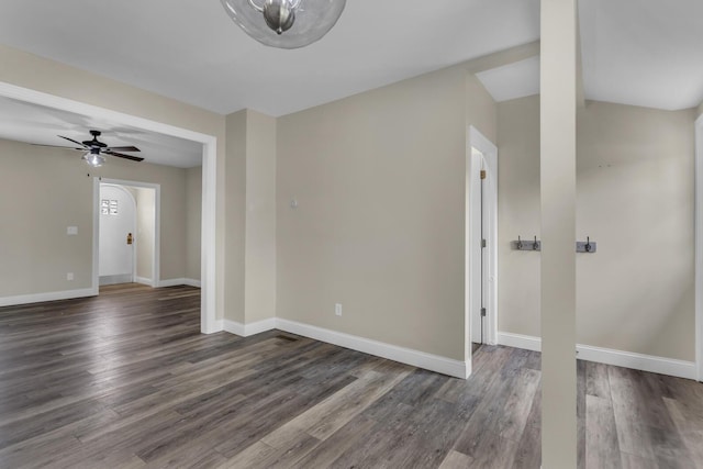 808 Longfellow Ave, Jackson, MI 49202 - spare room featuring arched walkways, wood finished floors, a ceiling fan, and baseboards