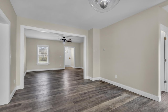 808 Longfellow Ave, Jackson, MI 49202 - empty room featuring a ceiling fan, baseboards, and dark wood-style flooring