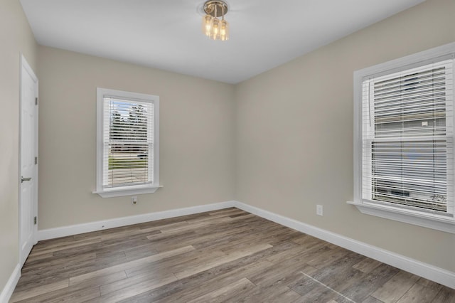 808 Longfellow Ave, Jackson, MI 49202 - spare room featuring wood finished floors and baseboards