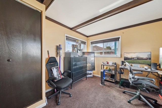 carpeted office with beamed ceiling and baseboards