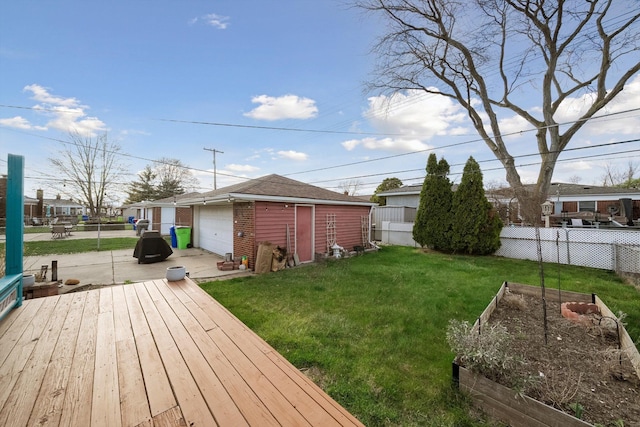 view of yard featuring an outbuilding, a vegetable garden, and fence