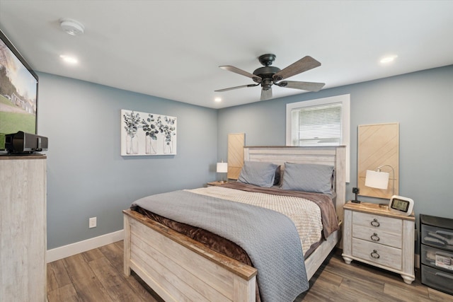 bedroom with ceiling fan, dark wood-type flooring, and recessed lighting