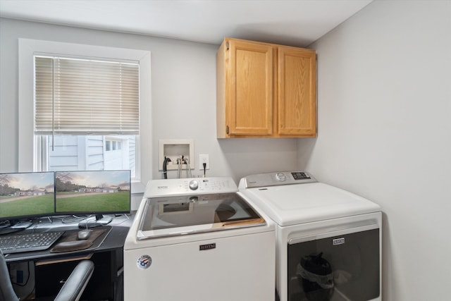 laundry area featuring cabinet space and washer and clothes dryer