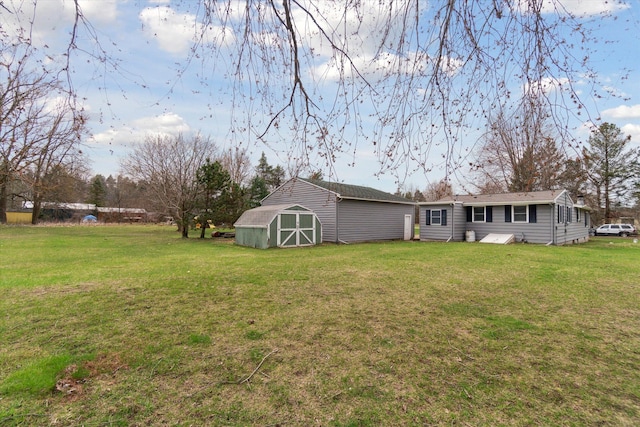 view of yard with an outbuilding and a storage shed