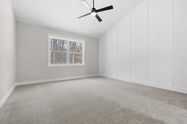 2630 Ashford Trl, Portage, MI 49024 - spare room with ceiling fan, vaulted ceiling, carpet, and baseboards