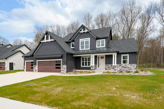 2630 Ashford Trl, Portage, MI 49024 - craftsman-style home featuring a standing seam roof, a garage, a shingled roof, stone siding, and board and batten siding
