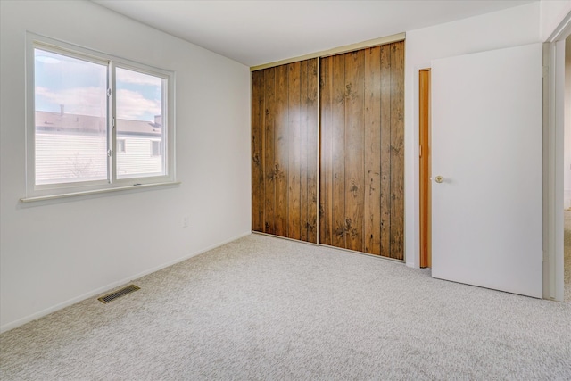 2919 Roundtree Dr, Troy, MI 48083 - unfurnished bedroom with a closet, carpet floors, and baseboards