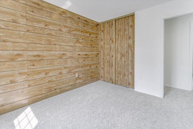 2919 Roundtree Dr, Troy, MI 48083 - carpeted empty room featuring wooden walls