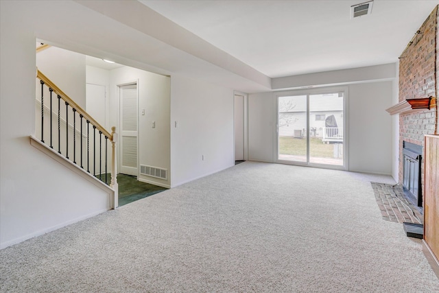 2919 Roundtree Dr, Troy, MI 48083 - unfurnished living room featuring carpet floors, a brick fireplace, stairs, and baseboards