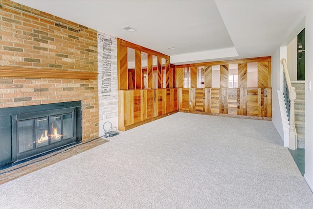 2919 Roundtree Dr, Troy, MI 48083 - unfurnished living room with carpet floors, a brick fireplace, and stairway