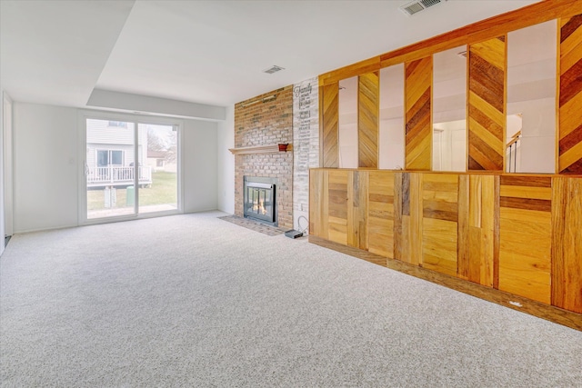 2919 Roundtree Dr, Troy, MI 48083 - unfurnished living room featuring carpet and a fireplace