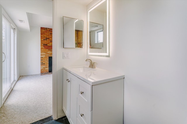 2919 Roundtree Dr, Troy, MI 48083 - bathroom with a fireplace and vanity