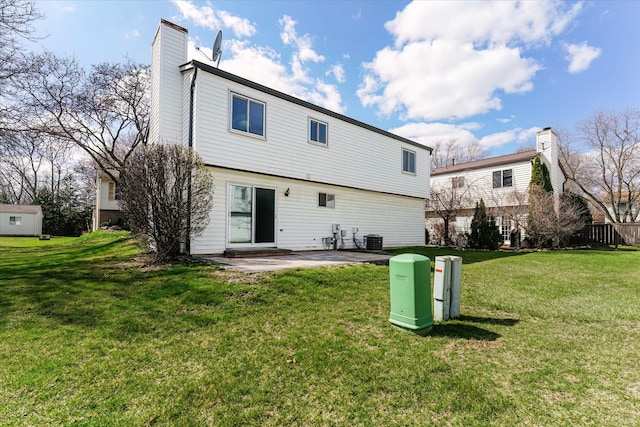 2919 Roundtree Dr, Troy, MI 48083 - back of property with a patio area, a chimney, a lawn, and cooling unit