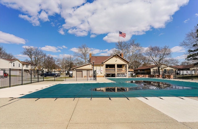 2919 Roundtree Dr, Troy, MI 48083 - community pool featuring a patio and a residential view