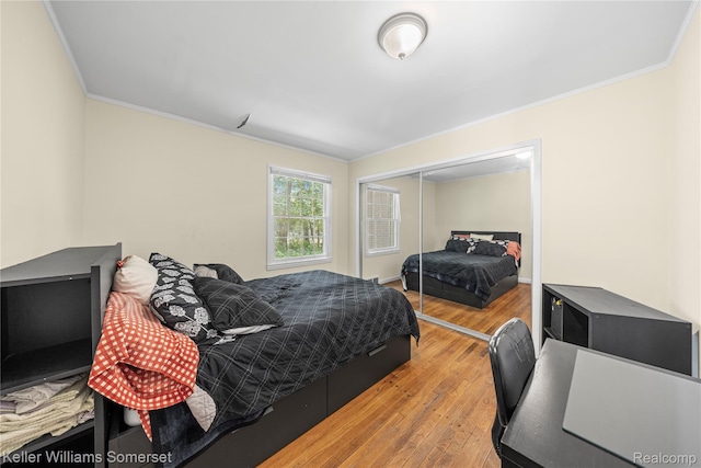 21700 W 13 Mile Rd, Beverly Hills, MI 48025 - bedroom with ornamental molding, wood finished floors, and a closet