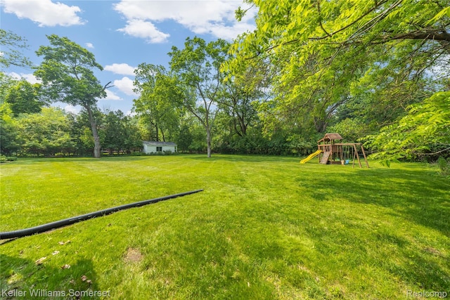 21700 W 13 Mile Rd, Beverly Hills, MI 48025 - view of green lawn featuring a playground