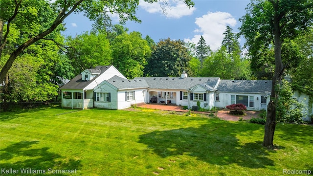 21700 W 13 Mile Rd, Beverly Hills, MI 48025 - rear view of property featuring a chimney