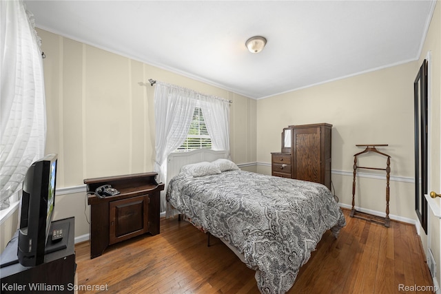 21700 W 13 Mile Rd, Beverly Hills, MI 48025 - bedroom with wood-type flooring, crown molding, and baseboards