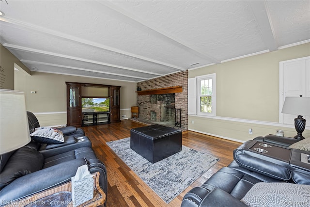21700 W 13 Mile Rd, Beverly Hills, MI 48025 - living room featuring wood finished floors, a fireplace, a textured ceiling, beam ceiling, and wainscoting