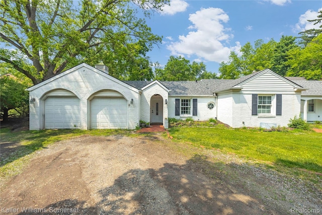 21700 W 13 Mile Rd, Beverly Hills, MI 48025 - view of front of house featuring dirt driveway, brick siding, an attached garage, and a chimney