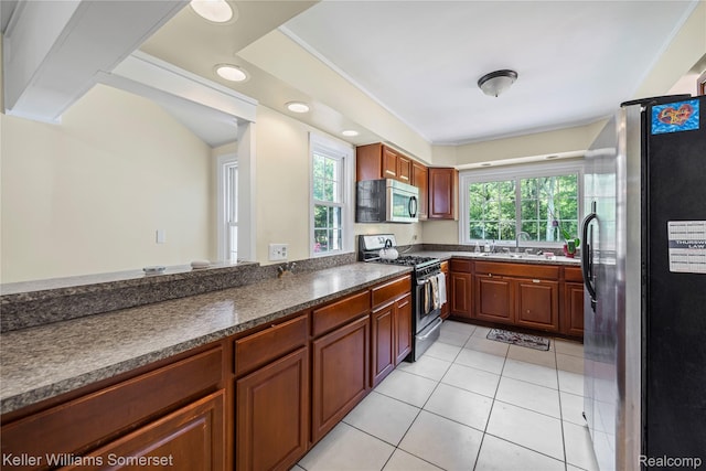 21700 W 13 Mile Rd, Beverly Hills, MI 48025 - kitchen featuring stainless steel appliances, healthy amount of natural light, light tile patterned flooring, a sink, and recessed lighting