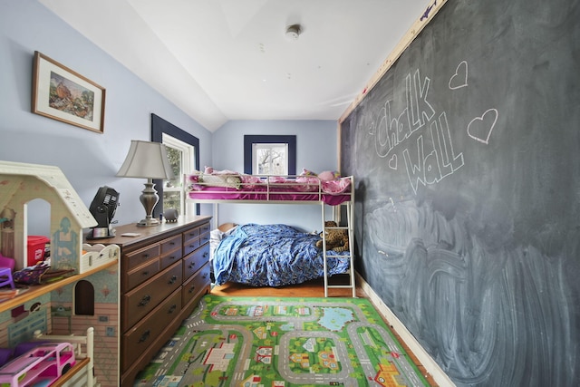 124 Broad St, Brooklyn, MI 49230 - bedroom with lofted ceiling and wood finished floors