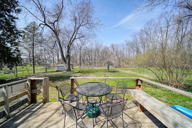 124 Broad St, Brooklyn, MI 49230 - deck with outdoor dining area and a lawn