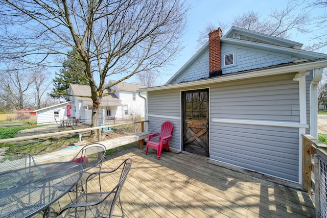 124 Broad St, Brooklyn, MI 49230 - wooden deck with an outbuilding and outdoor dining space