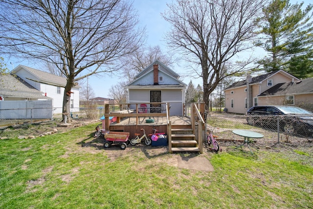 124 Broad St, Brooklyn, MI 49230 - view of yard featuring a wooden deck and fence