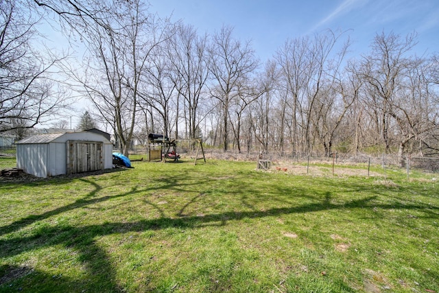 124 Broad St, Brooklyn, MI 49230 - view of yard with an outdoor structure, fence, and a storage shed