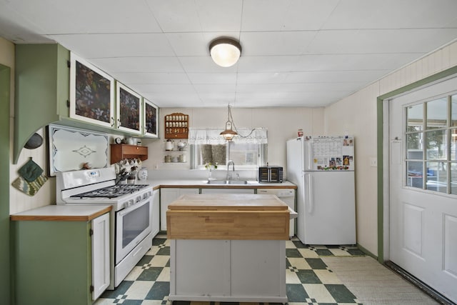 124 Broad St, Brooklyn, MI 49230 - kitchen featuring a center island, a sink, wood counters, white appliances, and light floors