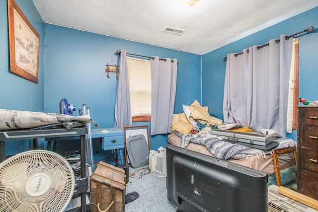 bedroom featuring visible vents