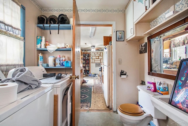 laundry room with separate washer and dryer, ceiling fan, and laundry area
