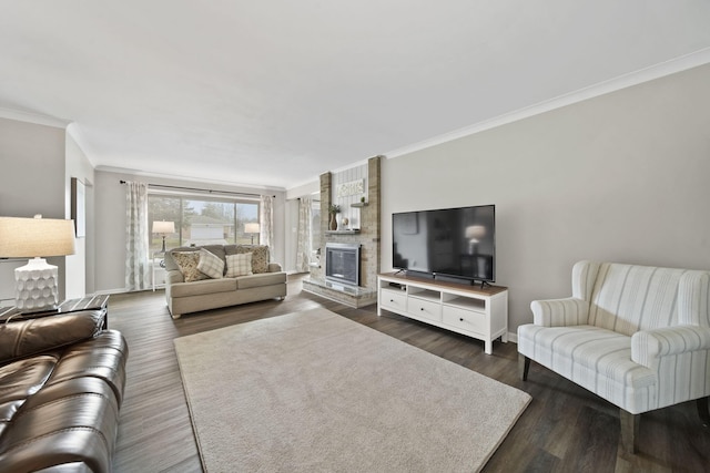 living room with a fireplace, dark wood finished floors, crown molding, and baseboards