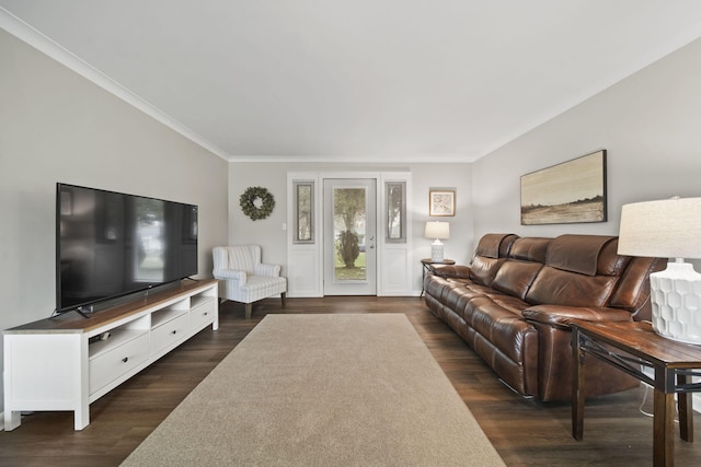 living area with dark wood-style floors and ornamental molding