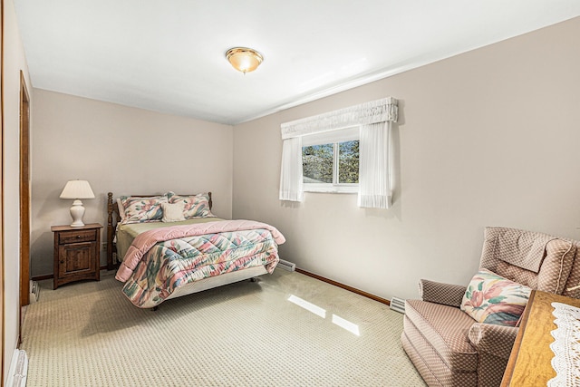 carpeted bedroom featuring baseboards
