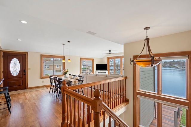 entryway featuring visible vents, wood finished floors, baseboards, and recessed lighting