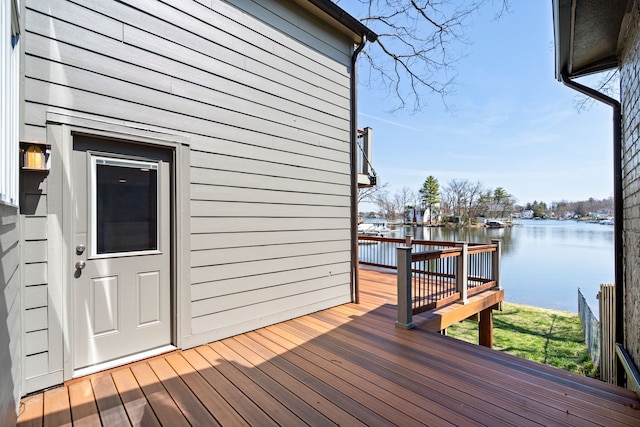 wooden deck featuring a water view