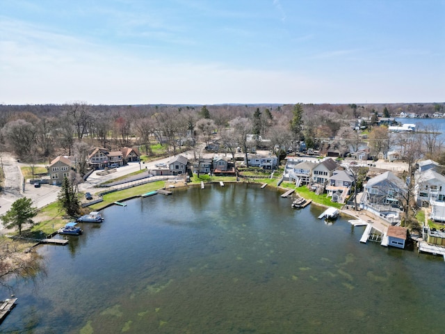 birds eye view of property featuring a water view and a residential view