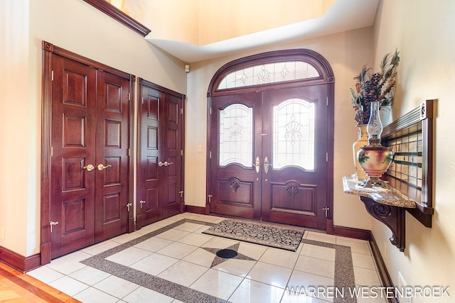 3550 64th Ave, Zeeland, MI 49464 - foyer with inlaid floor details, a high ceiling, and light tile patterned flooring