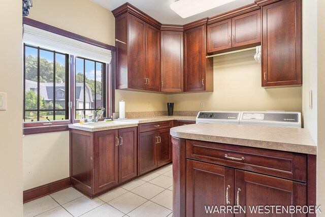 3550 64th Ave, Zeeland, MI 49464 - washroom with cabinet space, washer and dryer, and light tile patterned floors