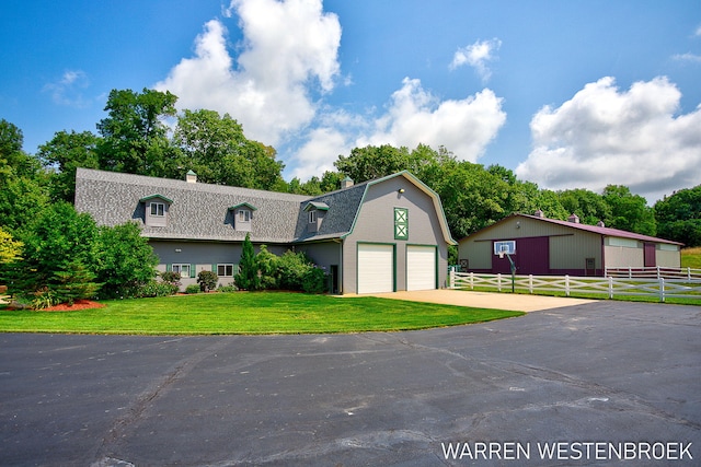 3550 64th Ave, Zeeland, MI 49464 - dutch colonial with a gambrel roof, roof with shingles, a chimney, and driveway